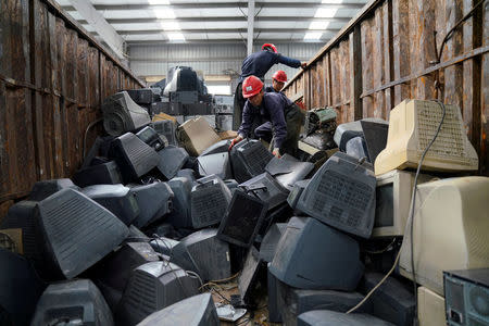 Monitors about to be recycled are seen in a warehouse at the government-sponsored recycling park in the township of Guiyu, Guangdong Province, China January 12, 2018. REUTERS/Aly Song