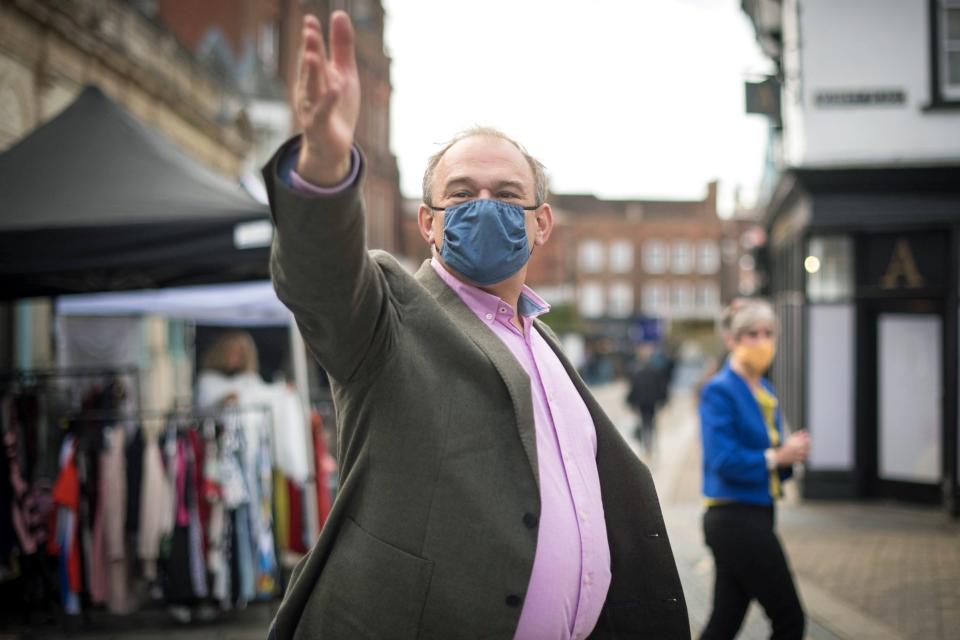 Lib Dem leader Ed Davey at St Albans city centre in Hertfordshire where he met shop owners and vendors and discussed how they are coping with the latest Covid19 restrictions (PA)