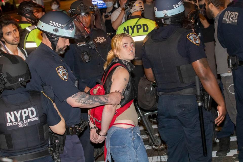 An anti-Israel protester is arrested by the NYPD on Tuesday night. NY Post