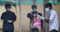 Health workers collect a nasal swab sample to test for COVID-19 in Hyderabad, India, Thursday, Sept. 17, 2020. As India’s coronavirus confirmed cases jump by a record 97,894 cases in the past 24 hours, Prime Minister Narendra Modi’s government faced a scathing opposition criticism in Parliament for its handling of the pandemic and a contracting economy leaving millions jobless on Thursday. (AP Photo/Mahesh Kumar A.)