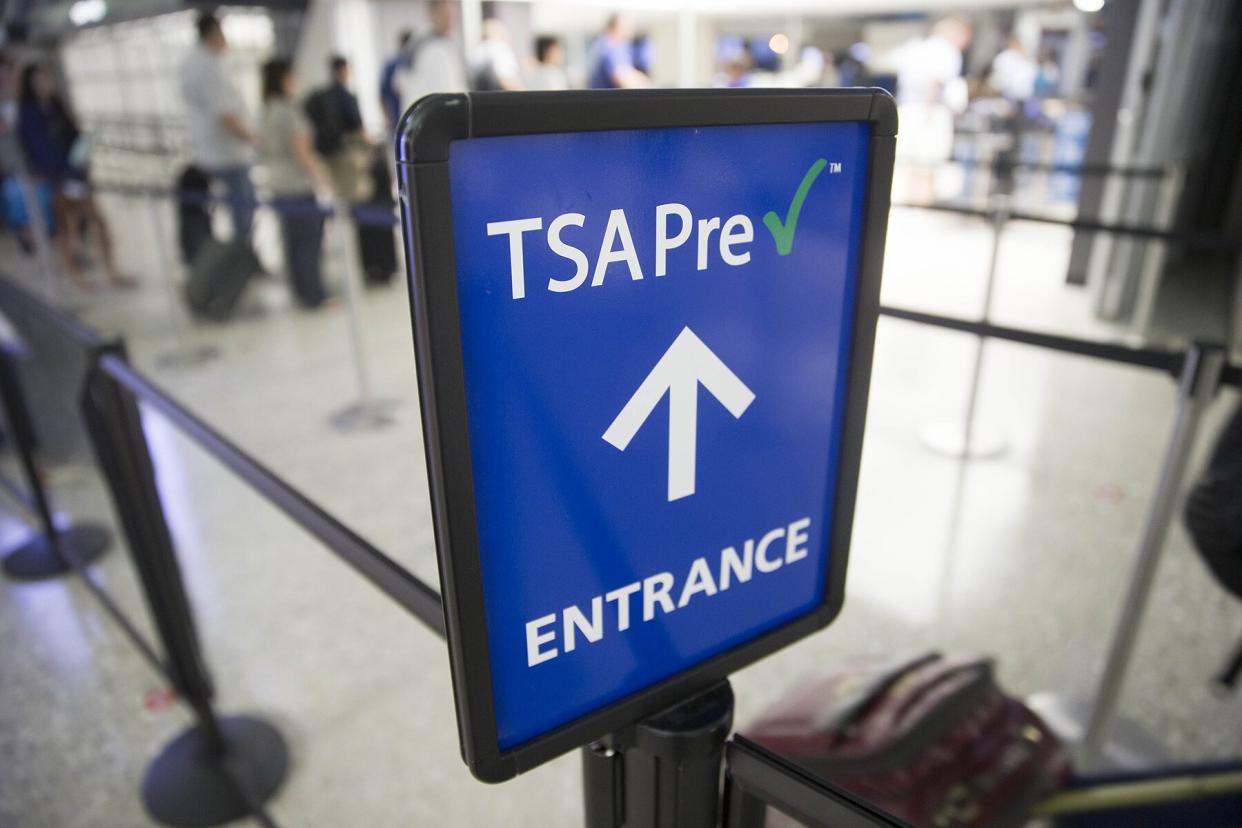 A Transportation Security Administration (TSA) pre-check sign stands at Dulles International Airport in Dulles, Virginia, U.S