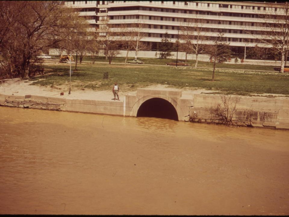 The Goergetown Gap, Through Which Raw Sewage Flows into the Potomac. Watergate Complex in the Rear, 04/1973.