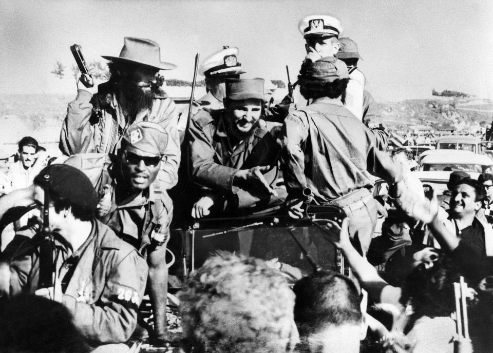 cuba 1959 revolution fidel castro 13081926 politician, cuba head of government 1959, head of state 1976 the revolutionists, led by fidel castro center and cheered on by the population, are invading havana on 0801 left from casto with gun