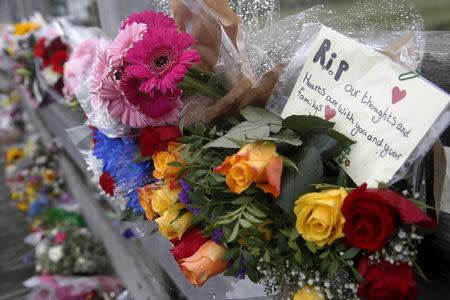 A message is left among flowers near to the location where a Hawker Hunter fighter jet crashed onto the A27 road at Shoreham near Brighton, Britain August 24, 2015. REUTERS/Luke MacGregor