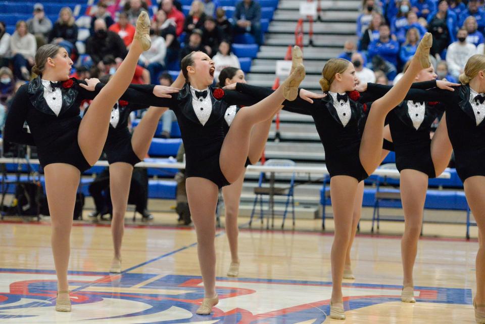 The Sauk Rapids-Rice dancers show their expression during its high kick routine at the Central Lakes Conference dance meet at Apollo High School on Friday, Dec. 3, 2021.