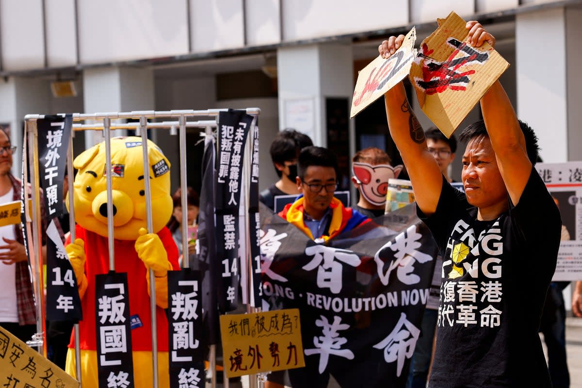 File image: Henry Tong, an exiled Hong Kong activist who is currently living in Taiwan, tears apart a cardboard with 23 on it, during a protest against Hong Kong's Article 23 national security law in Taipei, Taiwan  (REUTERS)