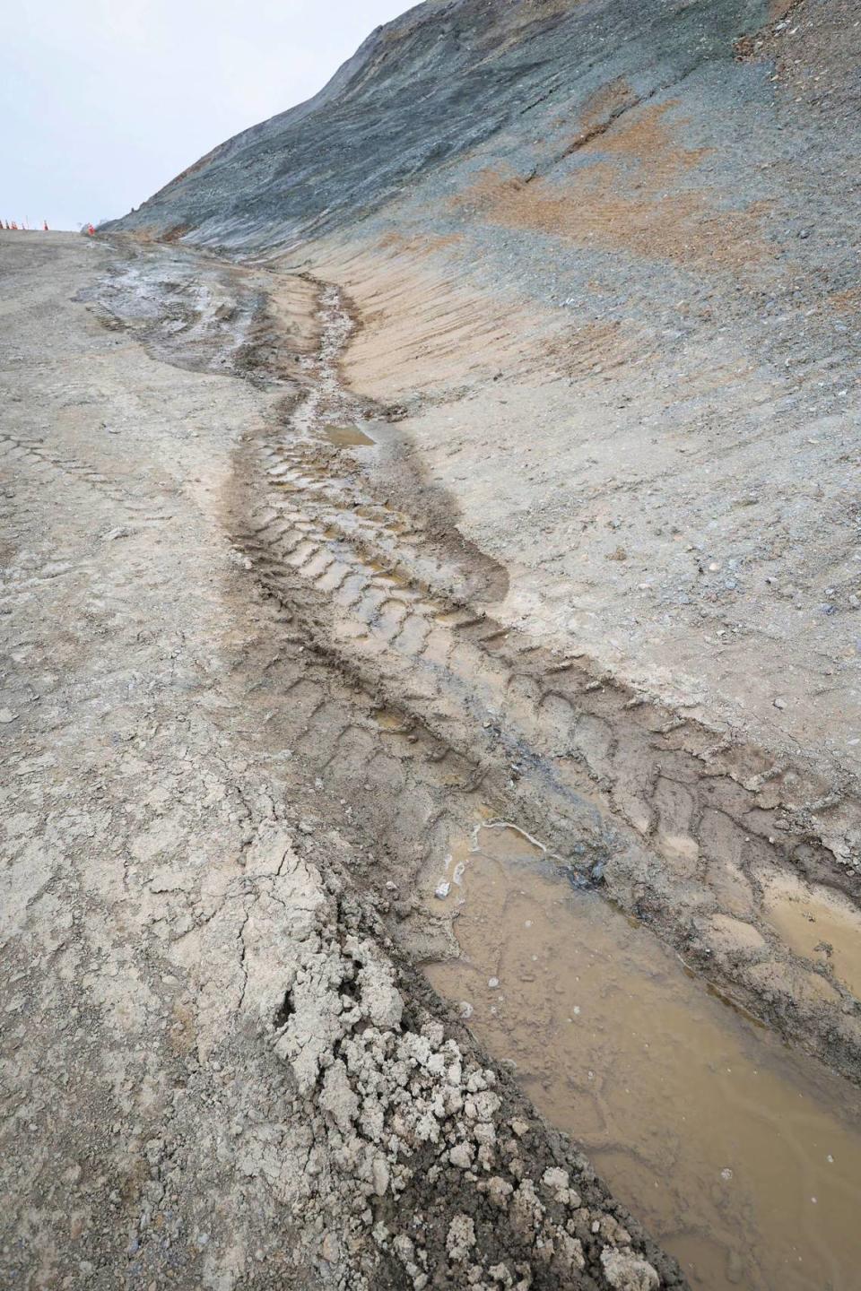 Crews from Papich Construction Co. work on Paul’s Slide on Highway 1 north of Gorda on May 17, 2024. Months after the heaviest rains of the season water is still seeping from the hillside.