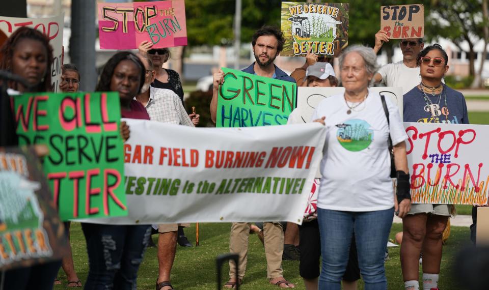 About 60 people gathered Saturday in West Palm Beach to protest air pollution in the Glades communities caused by sugar-cane burning.