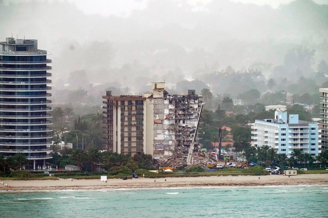 Workers search in the rubble at the Champlain Towers South Condo, Saturday, June 26, 2021, in Surfside, Fla.