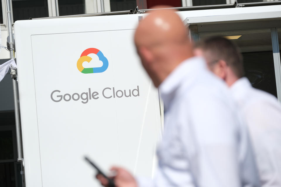 FRANKFURT AM MAIN, GERMANY - SEPTEMBER 11: People walk past a Google Cloud exhibit during the press days at the 2019 IAA Frankfurt Auto Show on September 11, 2019 in Frankfurt am Main, Germany. The IAA will be open to the public from September 12 through 22. (Photo by Sean Gallup/Getty Images)