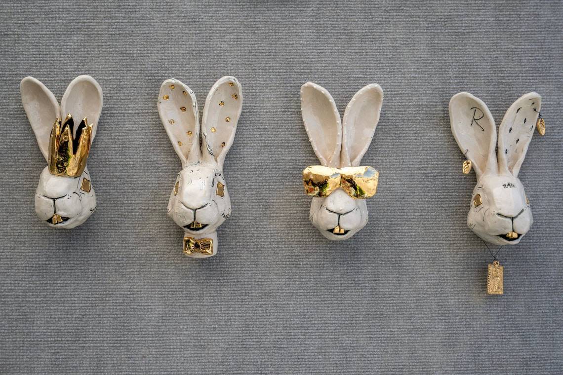 Ceramic rabbits, known as “Bling buns” and crafted by artist Reiko Uchytil of Grimes, Iowa, are displayed at her booth while preparing for the Brookside Art Annual on Friday in Kansas City.