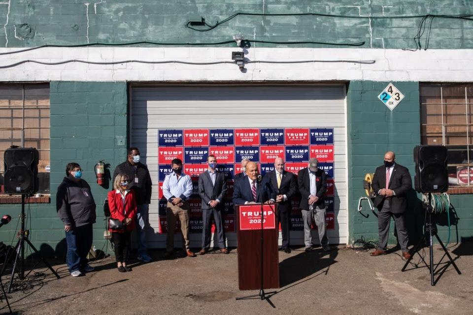 Rudy Giuliani speaks to the media in the car park of Four Seasons Total Landscaping in Philadelphia, Pennsylvania (Getty Images)