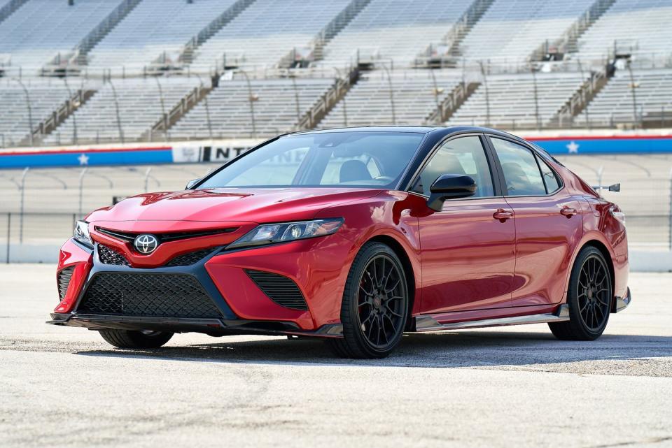 <p>For 2020 a <a href="https://www.caranddriver.com/news/a28788191/2020-toyota-camry-trd-pricing/" rel="nofollow noopener" target="_blank" data-ylk="slk:Camry TRD sporty model;elm:context_link;itc:0;sec:content-canvas" class="link ">Camry TRD sporty model</a> was added with firmer suspension, racer-boy looks, but no power improvements from the 301-hp 3.5-liter V-6 already available in XSE and XLE trims. The spoilers and added aero aren't just there for looks, as the EPA-estimated combined mileage is down 1 mpg from other V-6 Camrys. Camry TRD pricing starts at $31,995, making it the cheapest way to get the Camry with a V-6 by $3960. </p>