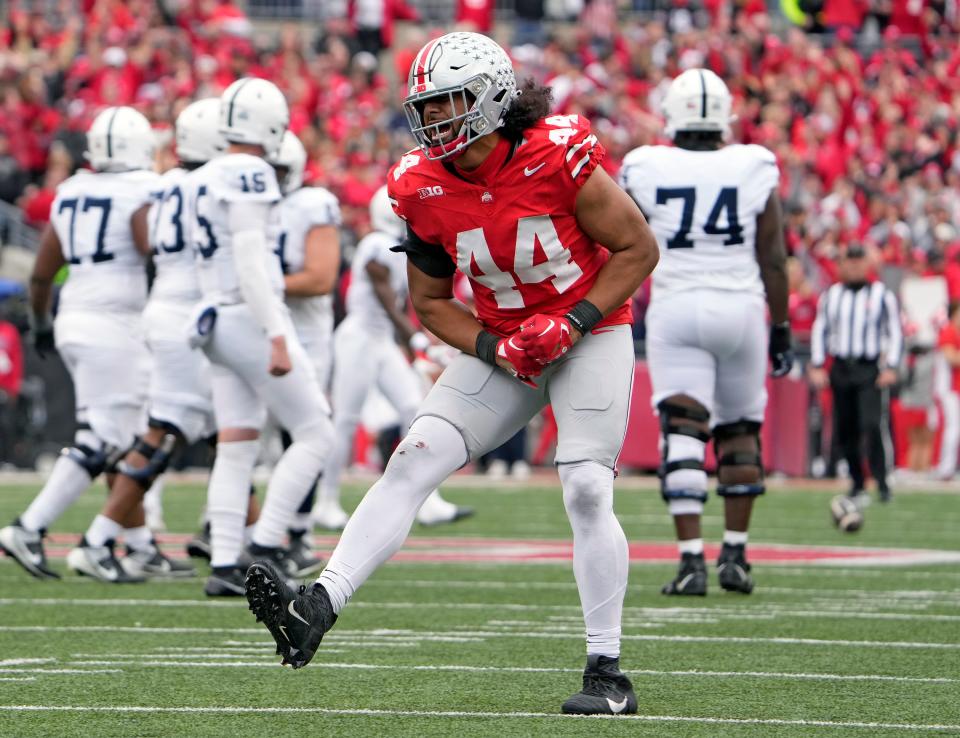 Ohio State defensive end JT Tuimoloau celebrates after a stop against Penn State on Saturday.