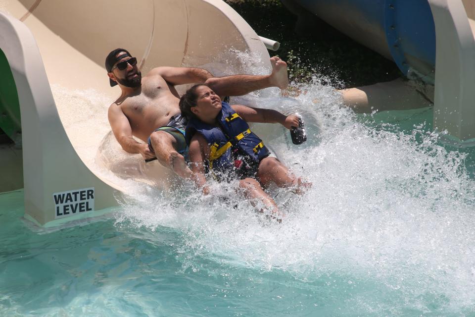 Guests ride the Momentum water slide at Hurricane Alley Waterpark Saturday, May 28, 2022.