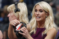 FILE - In this Nov. 9, 2018, file photo, Sarah Kustok, television color analyst for the Brooklyn Nets, prepares for the team's NBA basketball game against the Denver Nuggets in Denver. Women are impacting every aspect of the NBA, from broadcasting booths, to officiating, coaching on the sidelines, front-office executives to ownership. (AP Photo/David Zalubowski, File)