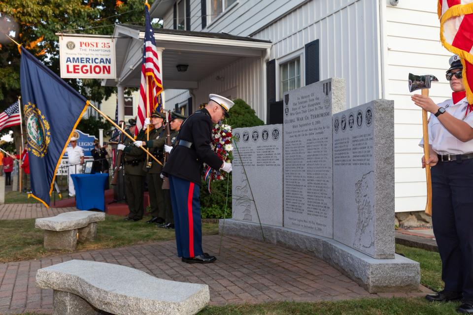 Chief Warrant Officer Anthony Martino, USMC, Afghanistan/Iraq, lays a wreath at the Global War on Terrorism Monument during American Legion Post 35's “Day of Remembrance” on Sept. 11, 2024, in Hampton.