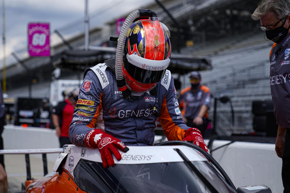 James Hinchcliffe, of Canada, climbs into his car during practice for the Indianapolis 500 auto race at Indianapolis Motor Speedway in Indianapolis, Wednesday, Aug. 12, 2020. (AP Photo/Michael Conroy)