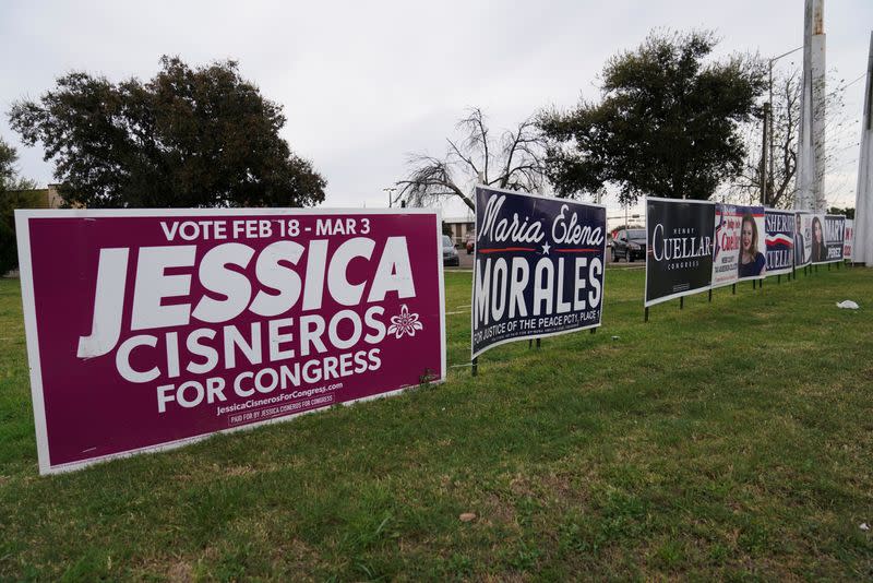 Signs for Democrat Jessica Cisneros, who campaigns for a House seat, and U.S. Rep. Henry Cuellar (D-TX) are seen in Laredo, Texas