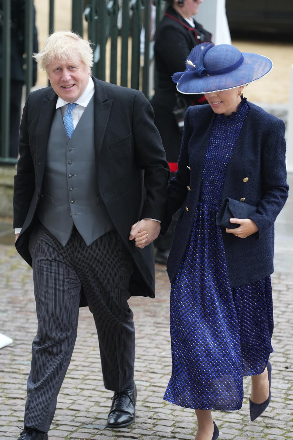 LONDON, ENGLAND - MAY 06: Former British Prime Minister Boris Johnson and and Carrie Johnson arrive ahead of the Coronation of King Charles III and Queen Camilla on May 6, 2023 in London, England. The Coronation of Charles III and his wife, Camilla, as King and Queen of the United Kingdom of Great Britain and Northern Ireland, and the other Commonwealth realms takes place at Westminster Abbey today. Charles acceded to the throne on 8 September 2022, upon the death of his mother, Elizabeth II. (Photo by Dan Charity - WPA Pool/Getty Images)