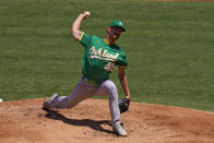 Oakland Athletics starting pitcher Chris Bassitt throws to the plate during the first inning of a baseball game against the Los Angeles Angels Wednesday, Aug. 12, 2020, in Anaheim, Calif. (AP Photo/Mark J. Terrill)