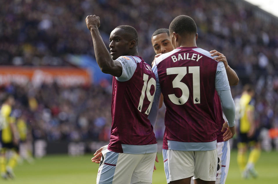 Aston Villa's Moussa Diaby, left, celebrates scoring their second goal of the game during the English Premier League soccer match between Bournemouth and Aston Villa at Villa Park stadium in Birmingham, England, Sunday April 21, 2024. (David Davies/PA via AP)