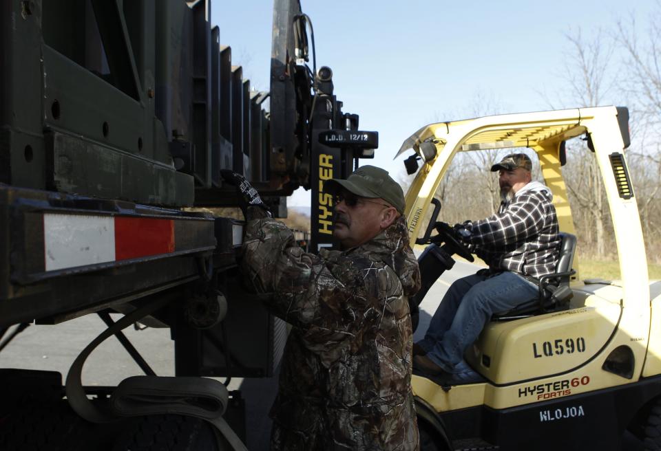 Materiel handlers Snyder and Ellis load Patriot missiles for transport at the U.S. Army Letterkenny Munitions Center in Chambersburg, Pennsylvania