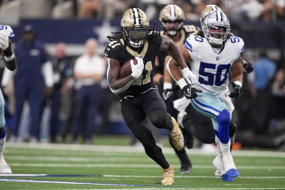 Saints running back Alvin Kamara had a monster game for fantasy managers, throwing for four touchdowns and 180 total yards in a win over the Cowboys. (AP Photo/Tony Gutierrez)