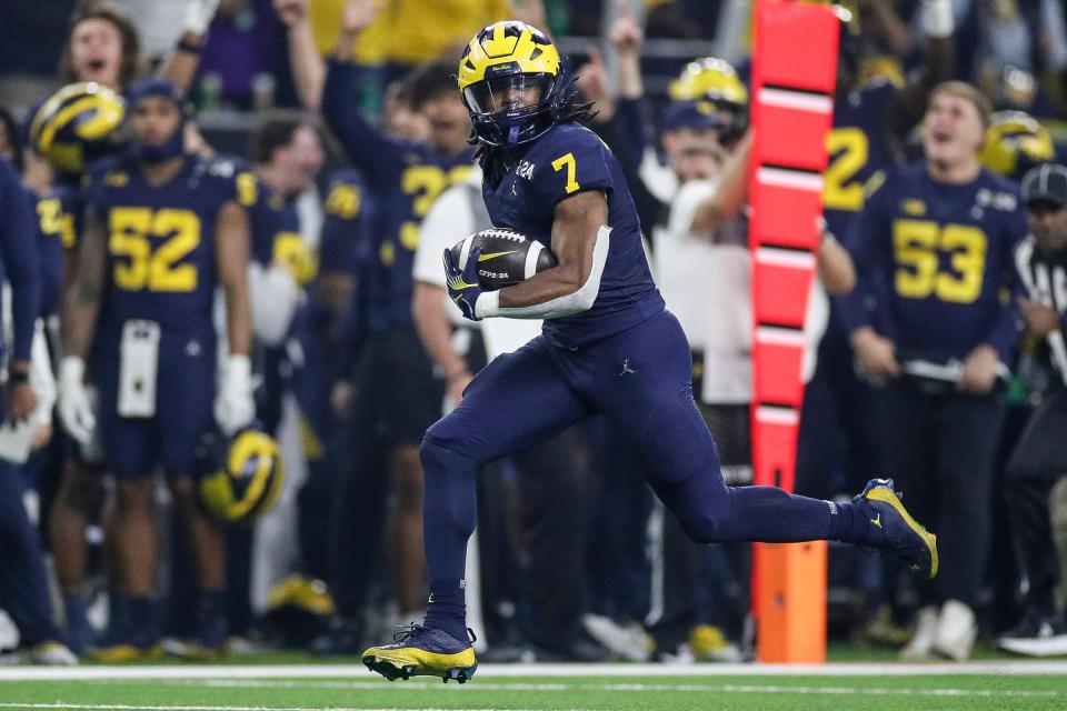 Michigan running back Donovan Edwards runs for a touchdown against Washington during the first half of the national championship game at NRG Stadium in Houston, Texas on Monday, Jan. 8, 2024.