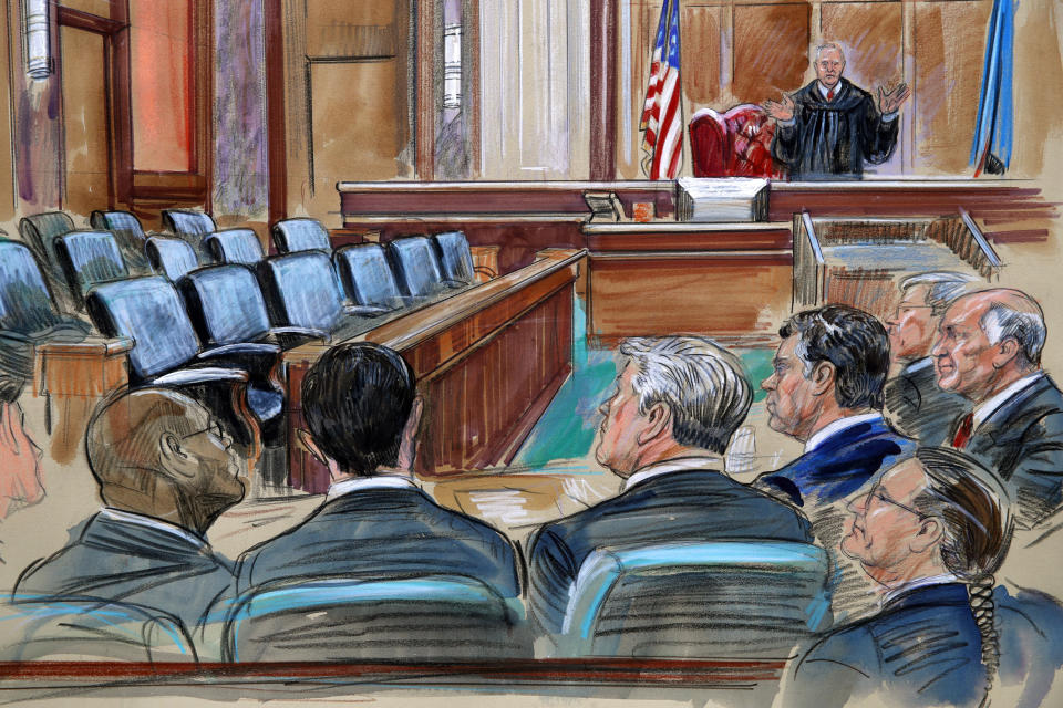 This courtroom sketch depicts U.S. District court Judge T.S. Ellis III speaking to the lawyers and defendant Paul Manafort, fourth from left, as the jury continues to deliberate in Manafort's trial on bank fraud and tax evasion at federal court in Alexandria, Va., Friday, Aug. 17, 2018. Third from left is Manafort's attorney Kevin Downing. (Dana Verkouteren via AP)