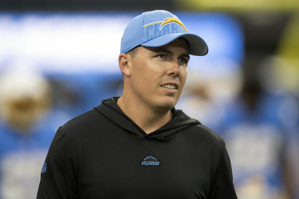 FILE - Los Angeles Chargers offensive coordinator Kellen Moore walks back to the locker room before an NFL preseason football game against the New Orleans Saints, Sunday, Aug. 20, 2023, in Inglewood, Calif. Kellen Moore and Vic Fangio were two of the most prominent coordinator hirings during the offseason. It also happens that both get to face each other in Week 1. (AP Photo/Kyusung Gong, File)