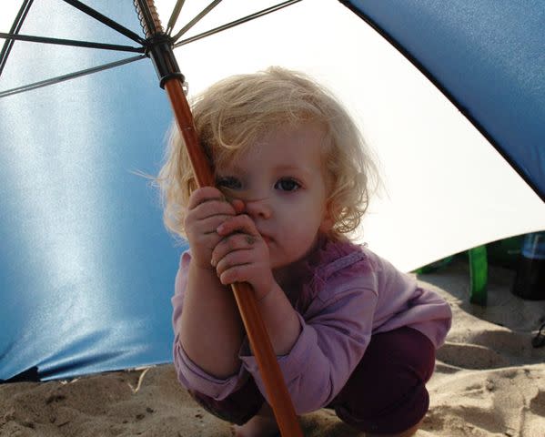 <p>Darren Le Gallo Instagram</p> Amy Adams' daughter Aviana poses for a photo on the beach under an umbrella