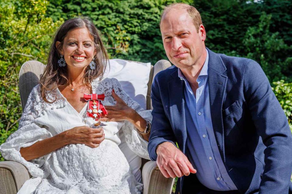 <p>Graham Prentice / Alamy</p> Prince William presenting Dame Deborah James with her Damehood honor 