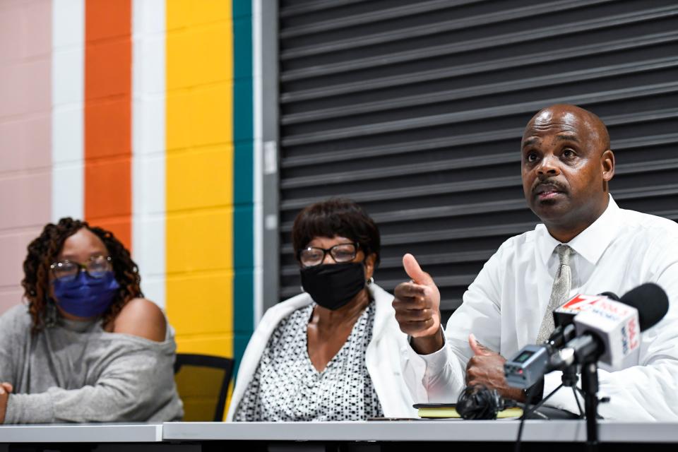 Bruce Wilson, founder of the community activist group Fighting Injustice Together, right, speaks about the death of Terrence Sligh while sitting next to Sligh's aunt, Cynthia Dorsey, and grandmother, Sarah Roberts, during a press conference at Jud Hub Social Innovation Center in Greenville on Monday, October 3, 2022. 