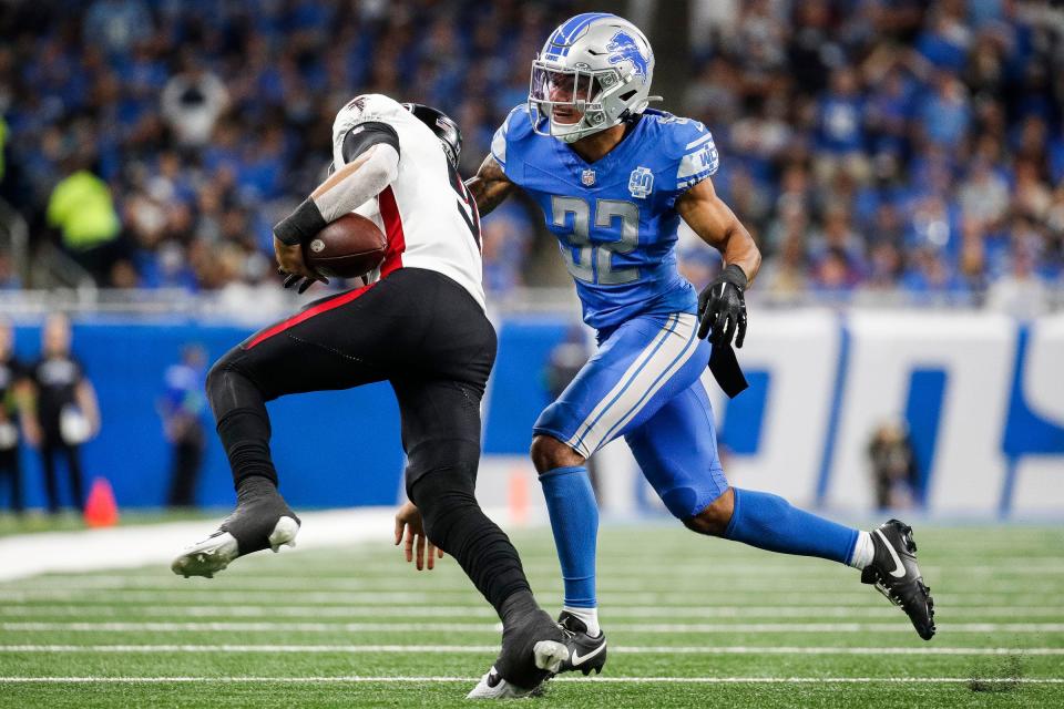 Detroit Lions safety Brian Branch (32) tackles Atlanta Falcons quarterback Desmond Ridder (9) during the second half at Ford Field in Detroit on Sunday, Sept. 24, 2023.