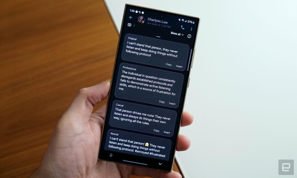 A photo of a Galaxy S24 Ultra held in someone's hand. That screen will display AI-suggested alternatives to Chat His Message.