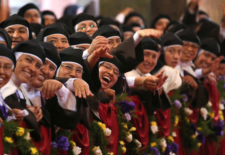 Nuns reacts as Pope Francis arrives to lead a mid-morning prayer with contemplative nuns at the Sanctuary of the Senor de los Milagros in Lima, Peru, January 21, 2018. REUTERS/Alessandro Bianchi