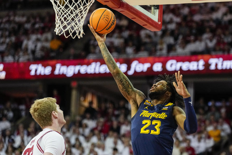 Marquette's David Joplin (23) shoots against Wisconsin's Steven Crowl during the first half of an NCAA college basketball game, Saturday, Dec. 2, 2023, in Madison, Wis. (AP Photo/Andy Manis)