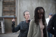 <p>Some people bring flowers, Melissa McBride brings a serrated machete for her surprise greeting for co-star Danai Gurira.<br><br>(Photo: AMC) </p>