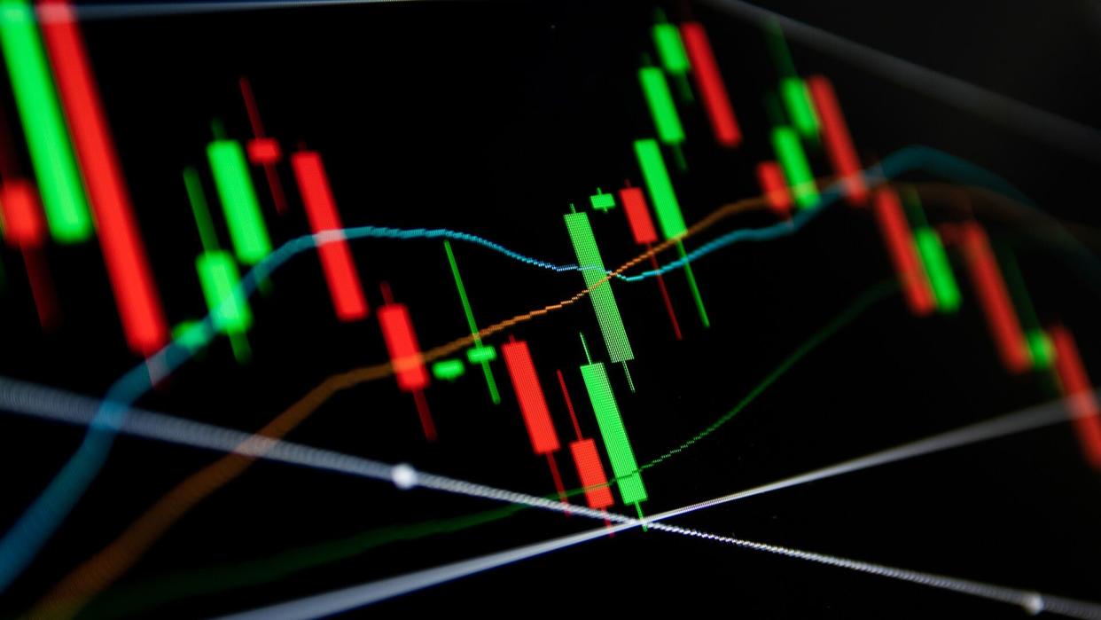 Forex concept : Candlestick chart red green in financial market for trading on black color background.