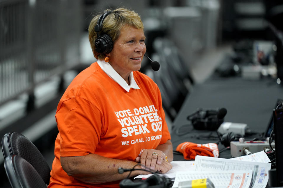Ann Meyers Drysdale prepares her court-side broadcast prior to a Phoenix Mercury basketball game, Friday, June 3, 2022 in Phoenix. Ann Meyers Drysdale was the first woman to receive an athletic scholarship at UCLA. The Hall of Famer, longtime TV basketball analyst and mother of three shares how Title IX has shaped her life and career in a story for The Associated Press, and what needs to be done over the next 50 years for the law to continue to have a positive impact on young girls and women. (AP Photo/Matt York)