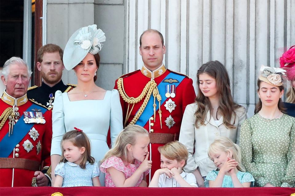 Members of the Royal Family (L-R) Britain's Prince Charles, Prince of Wales, Britain's Prince Harry, Britain's Catherine, Duchess of Cambridge (with Princess Charlotte, Savannah Phillips, Prince George) and Britain's Prince William, Duke of Cambridge, stand on the balcony of Buckingham Palace to watch a fly-past of aircraft by the Royal Air Force, in London on June 9, 2018. - The ceremony of Trooping the Colour is believed to have first been performed during the reign of King Charles II. In 1748, it was decided that the parade would be used to mark the official birthday of the Sovereign. More than 600 guardsmen and cavalry make up the parade, a celebration of the Sovereign's official birthday, although the Queen's actual birthday is on 21 April. (Photo by Daniel LEAL / AFP) (Photo by DANIEL LEAL/AFP via Getty Images)