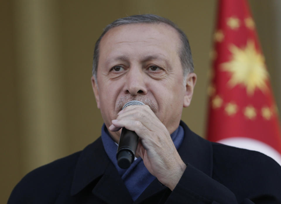 Turkey's President Recep Tayyip Erdogan, delivers a speech during a rally of supporters outside the Presidential Palace, in Ankara, Turkey, one day after the referendum, Monday, April 17, 2017. Turkey's main opposition party urged the country's electoral board Monday to cancel the results of a landmark referendum that granted sweeping new powers to Erdogan, citing what it called substantial voting irregularities. (AP Photo/Burhan Ozbilici)