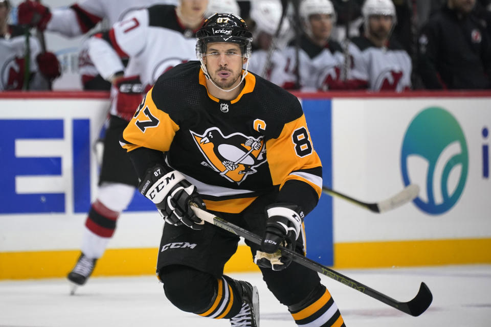 Pittsburgh Penguins' Sidney Crosby (87) skates during the second period of the team's NHL hockey game against the New Jersey Devils in Pittsburgh, Saturday, Oct. 30, 2021. It is Crosby's first game this season, after his recovery from wrist surgery. (AP Photo/Gene J. Puskar)