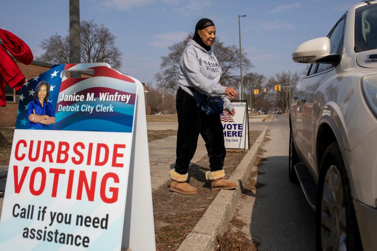 Rosalie Lewis, of Detroit, walks to her car after voting inside Osborn High School’s polling place during the presidential primary in Detroit on Tuesday, Feb. 27, 2024.