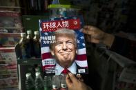 A copy of the Chinese magazine Global People with a cover story that translates to "Why did Trump win" at a news stand in Shanghai