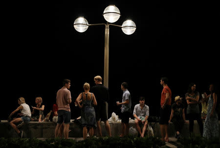 Tourists are seen outside a hotel as Hurricane Willa approaches the Pacific beach resort of Mazatlan, Mexico October 22, 2018. REUTERS/Henry Romero