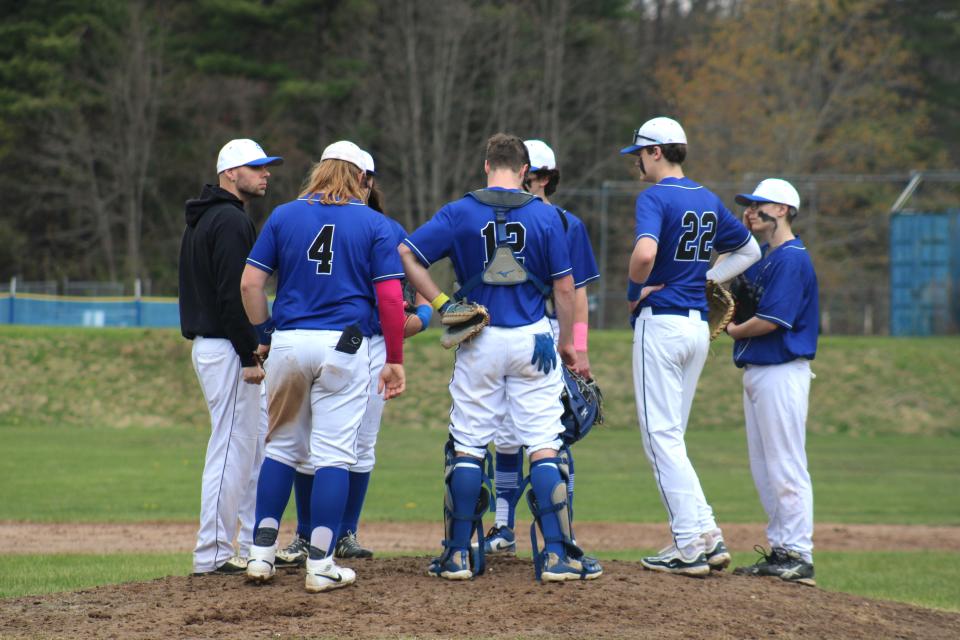 Coach Nick Taylor talks to the team on the mound during Murdock's game against Bromfield on May 1, 2024.