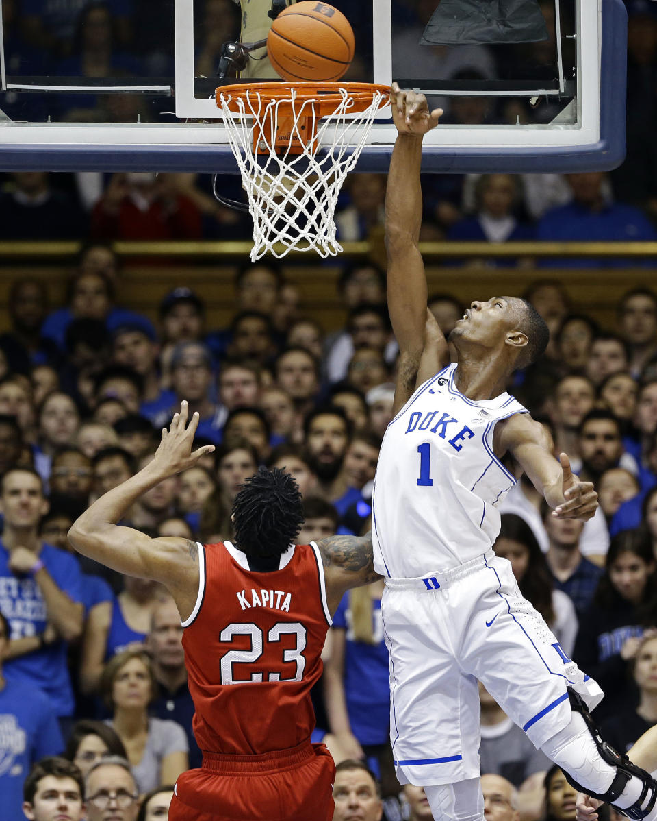 Duke's Harry Giles (1) tries to block North Carolina State's Ted Kapita (23) during the first half of an NCAA college basketball game in Durham, N.C., Monday, Jan. 23, 2017. (AP Photo/Gerry Broome)
