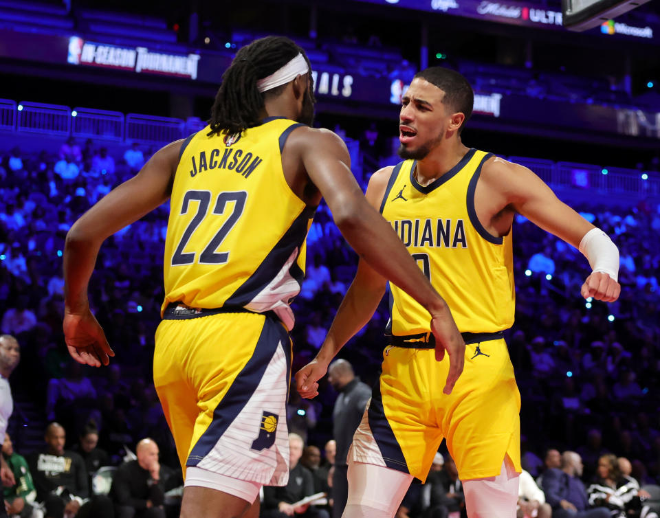 The Pacers' Isaiah Jackson and Tyrese Haliburton celebrate after Jackson scored and drew a foul against the Milwaukee Bucks in the first half of the East semifinal game of the inaugural NBA in-season tournament at T-Mobile Arena in Las Vegas, on Dec. 7, 2023. (Photo by Ethan Miller/Getty Images)